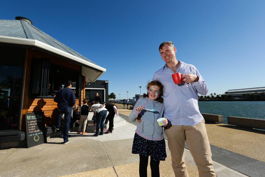 Lynch's Prawn shop has reopened on Honeysuckle as a cafe and bike rental. Jessica Kelly with her uncle, manager Blake Forrester.