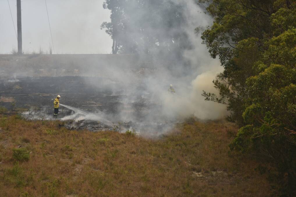Crews battling a fire at Wangi Wangi. Picture: Chris VanderSchaaf 