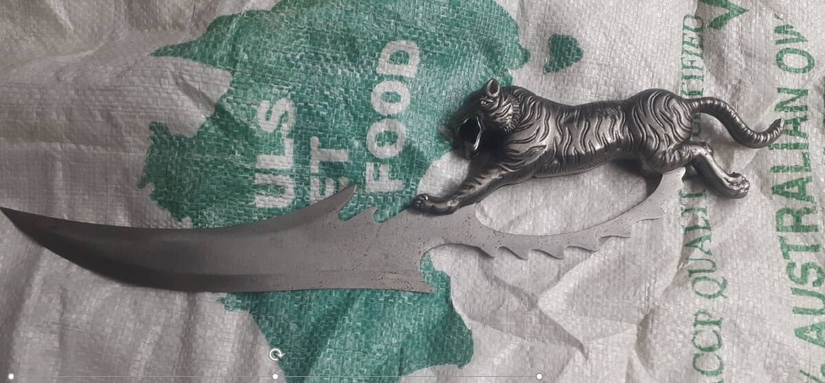 WEAPON: An ornamental trench knife allegedly found at the Wyee home on Comancheros associate John Fitzgerald on Wednesday. 