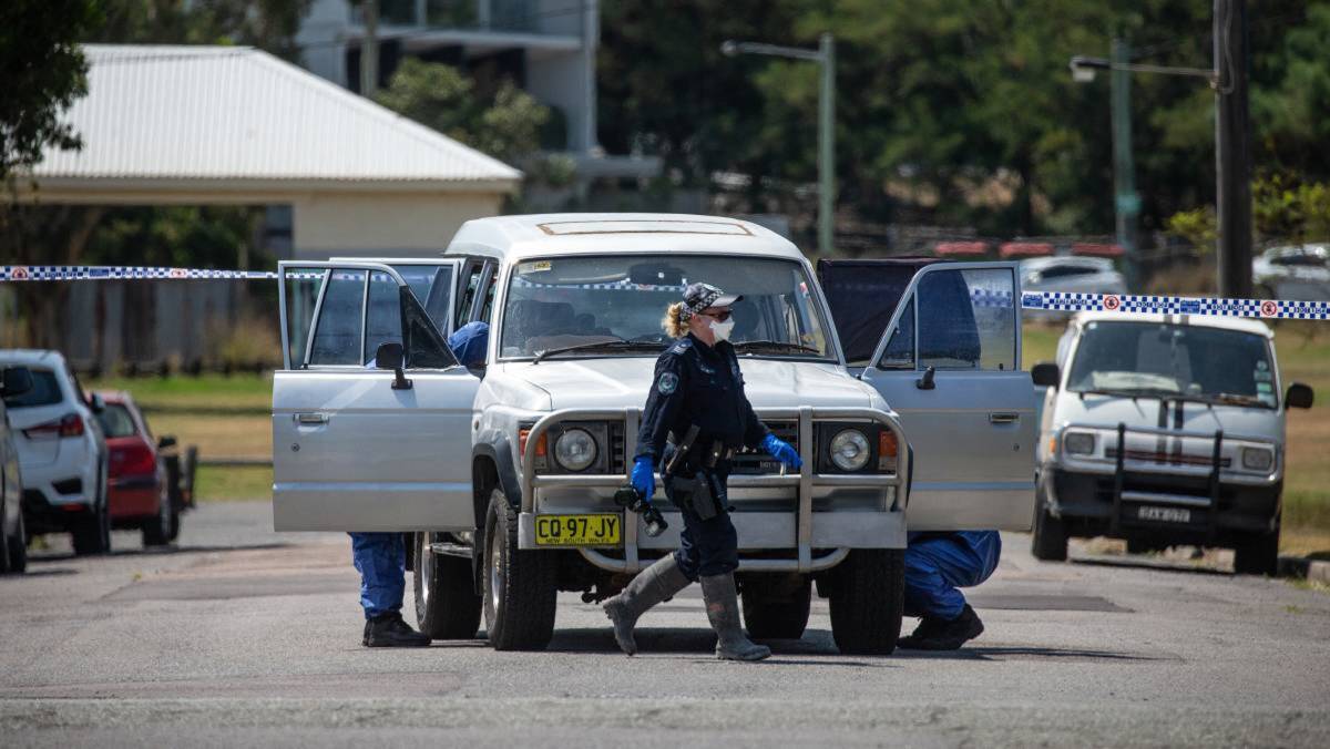 INVESTIGATION: Specialist police examining a crime scene at Mayfield on December 27, a day after Steven O'Brien was stabbed to death. Shaun Garry Johnson, 36, of Coopernook, has been charged with his mate's murder. Picture: Marina Neil
