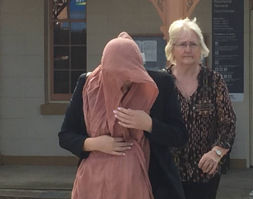 DISQUALIFIED: Caroline Ashthore Throwden (face covered) leaves Raymond Terrace Local Court on Monday after pleading guilty to high-range drink driving while picking up her daughter from school. 