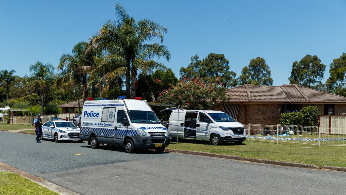 INVESTIGATION: Specialist crime scene police examine the house at Tenambit where Michael John Carroll was allegedly stabbed to death in January. Picture: Max Mason-Hubers