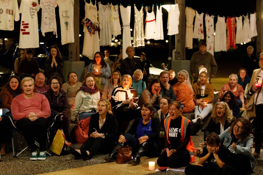 VIGIL: About 100 people attended an event in the tram sheds in Newcastle Foreshore Park earlier this month. Pictures: Max Mason-Hubers