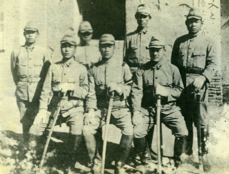 A group of Japanese Imperial army soldiers pose with their samurai swords. Image courtesy of University of Newcastle's Cultural Collections