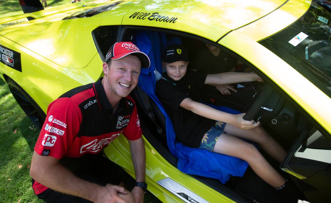 Suoercars driver Will Brown meets young fan Lucas Rundle at Civic Park on Saturday. Picture by Jonathan Carroll