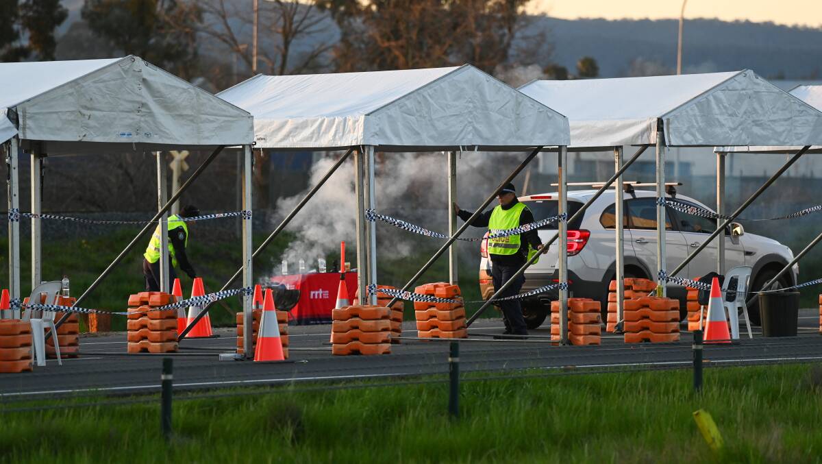 Police at the Hume Highway checkpoint in Albury. Picture: MARK JESSER
