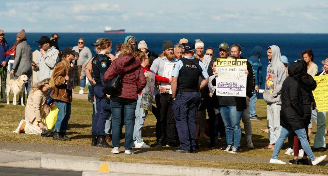 RALLY: Calling for an end to COVID-19 restrictions at Bar Beach. A second group also gathered at Newcastle's Foreshore Park.