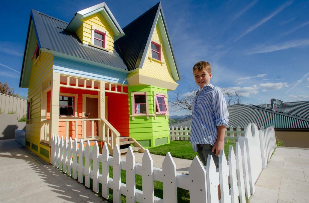 COOL: Leo Fincher, 7, with a replica of the house from Disney Pixar's Up that his dad, Scott Fincher built. Picture: Elesa Kurtz