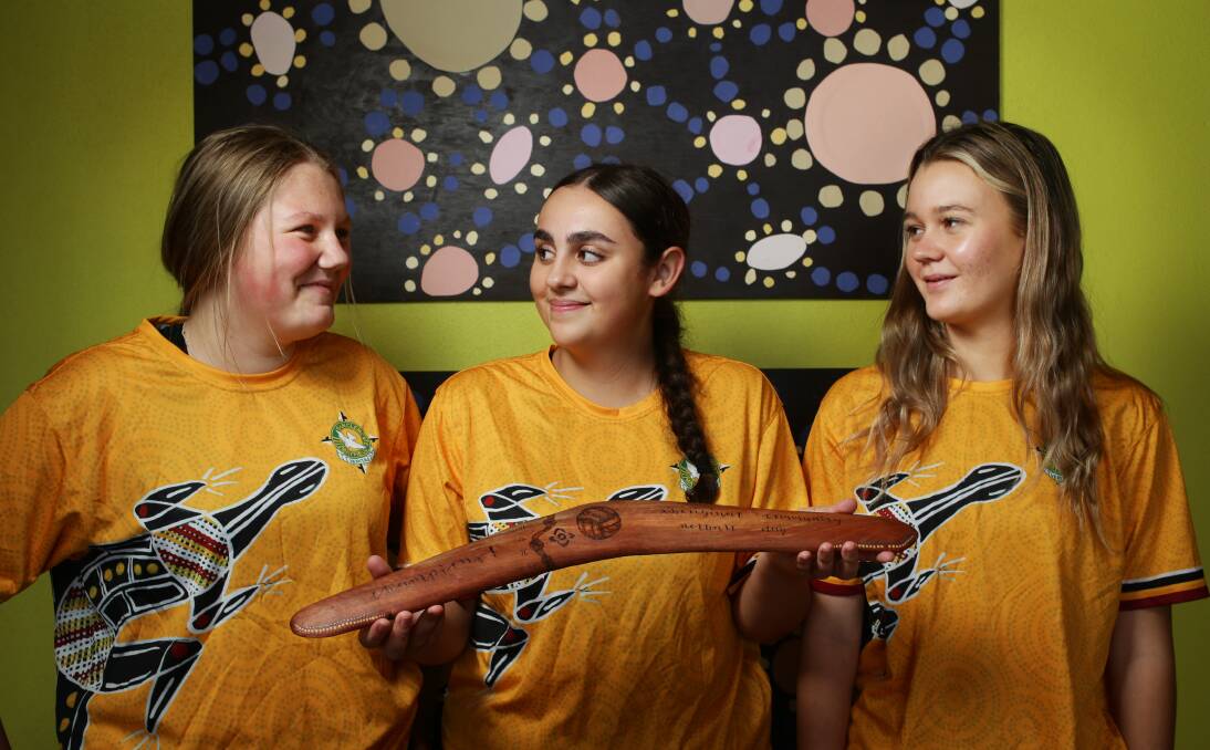 San Clemente High School students Lily Baleanu, Isabelle Pulbrook and Karlie Marriott planned a netball day to bring Aboriginal and Torres Strait Islander students in the diocese together. Picture by Simone De Peak