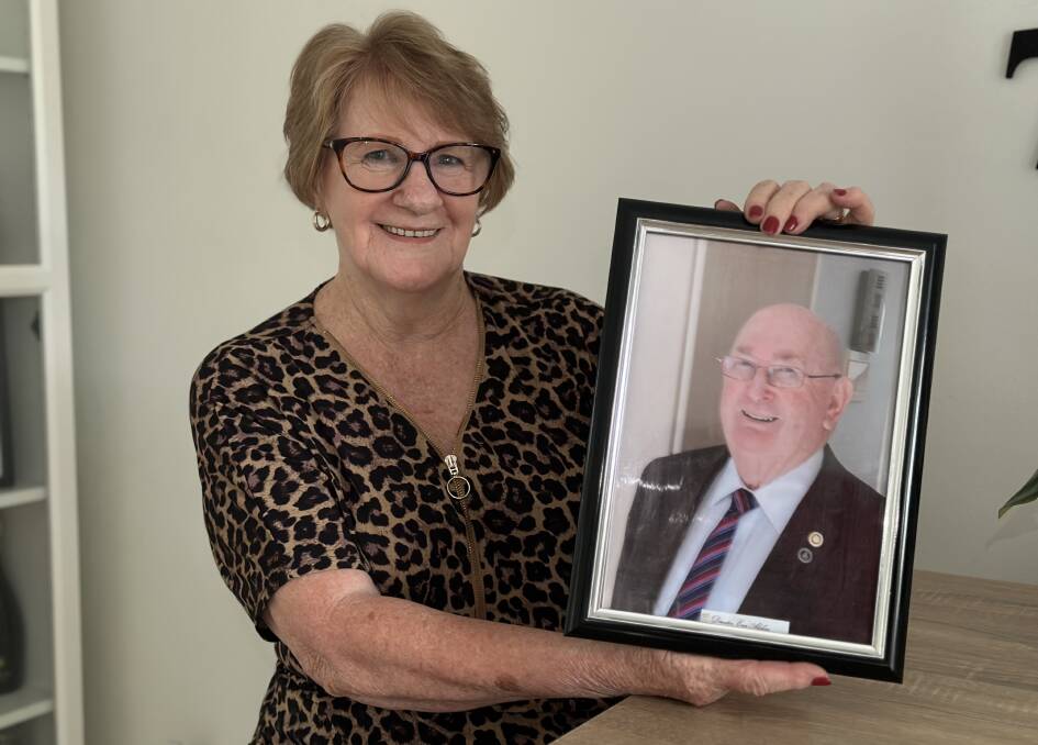Heather Alchin holds a picture of her late husband Ernest Alchin who has been honoured as an OAM recipient in the 2023 Australia Day awards. Picture by Alanna Tomazin