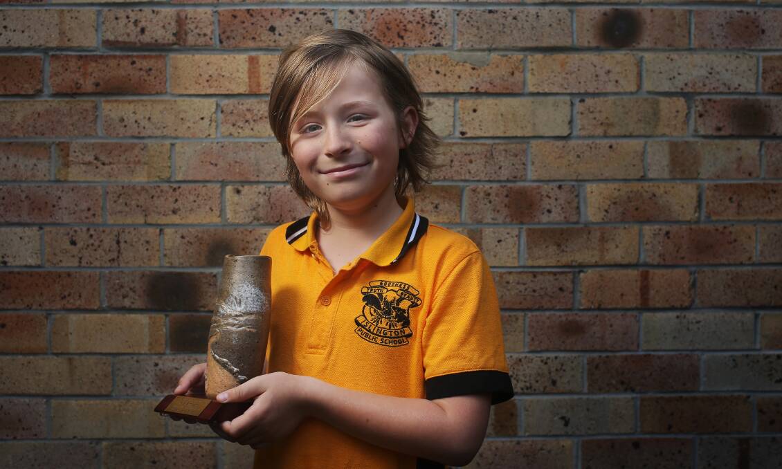Islington Public School student Alby Simpson, 8, proudly holds his Dorothea Mackellar Poetry Award. Picture by Simone De Peak