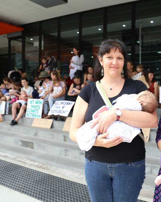 Alarm: Erin Killion, with her baby, said protesters were also concerned about sea level rise, drought and the food supply. "It's an urgent situation and there's no time to lose." Picture: Callan Lawrence.
