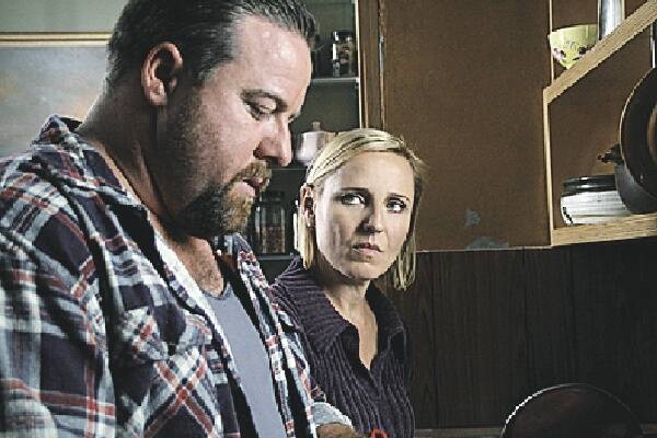 STARS: Shane Jacobson, of Kenny fame, and Joy Smithers in a scene from the movie.
