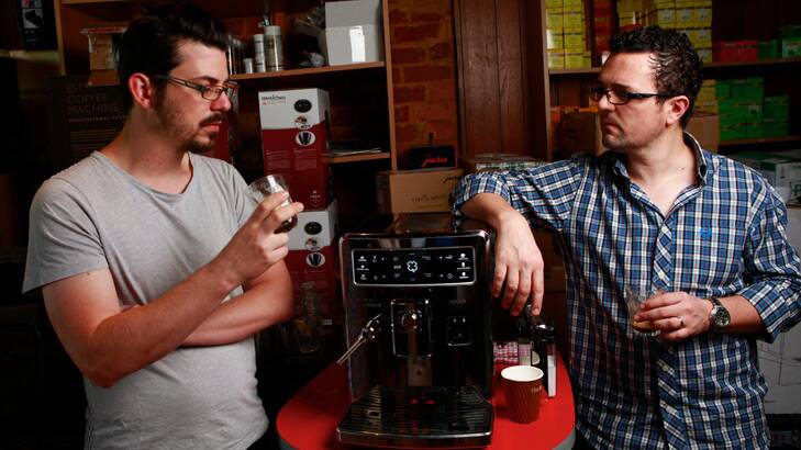 Baristas Craig Simon (left) and Dave Makin sample espresso from the Saeco Xelsis ID. Photo: Eddie Jim