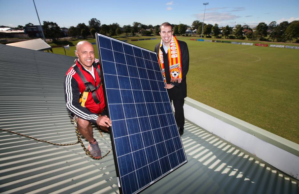 SUNNY BOYS: Broadmeadow's Vasco Grujevski with Abdullah Sultan, of Captain Green Solar, on top of Wanderers Oval's clubhouse. Picture: Dean Osland