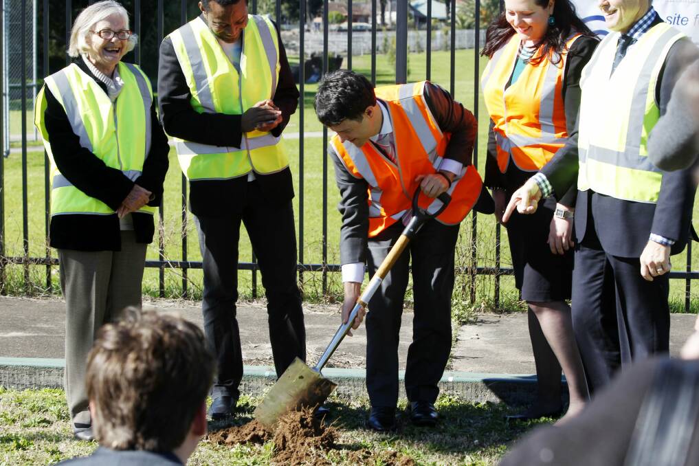 DIGGING IN: Victor Dominello turns the first sod.