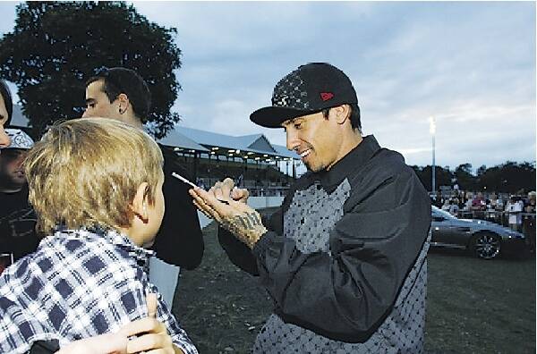 ALL SMILES: Mr Pink, Carey Hart, signs autographs at Newcastle Showground.