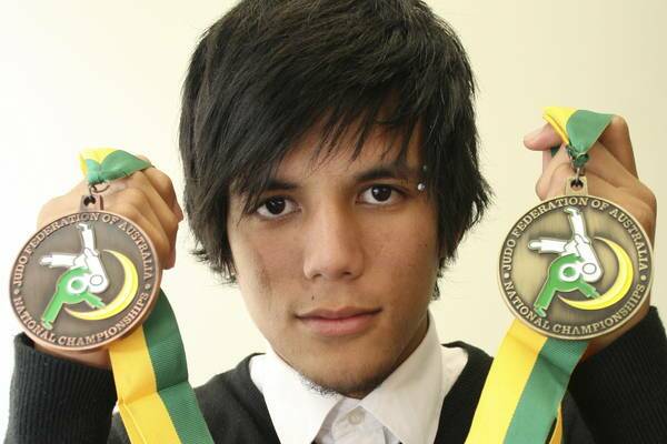 DOMINATOR: Liam Yokoyama with the gold and bronze medals he won at the national titles. Picture: David Stewart