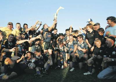 HAPPY DAYS: Money problems did not stop Lakes United celebrating their 2007 Newcastle Rugby League grand final victory.- Picture by Peter Stoop