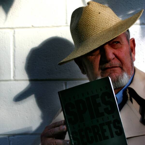 DISCOVERY: Geoff Walker with the book containing the signature of Russian spy Walter Clayton. - Picture by Kitty Hill