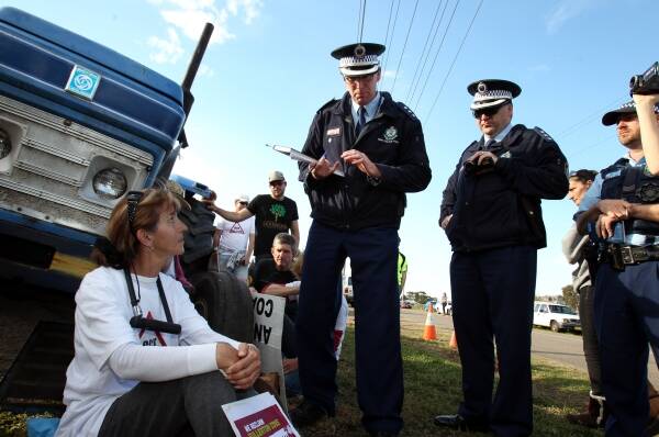  Police deliver infringement notices to Fullerton Cove Coal Seam Gas protesters. Picture: Max Mason-Hubers