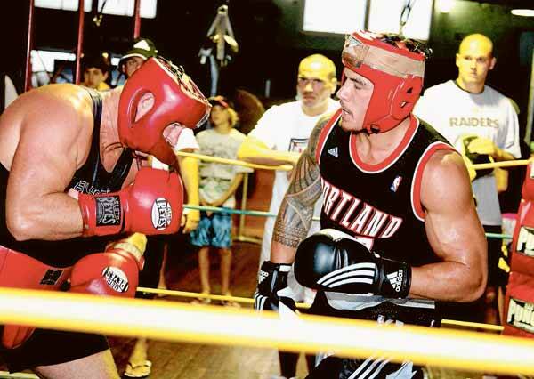 STAR ATTRACTION: Sonny Bill Williams spars with Bob Mirovic yesterday as Anthony Mundine and Cory Paterson look on. - Picture by Phil Hearne