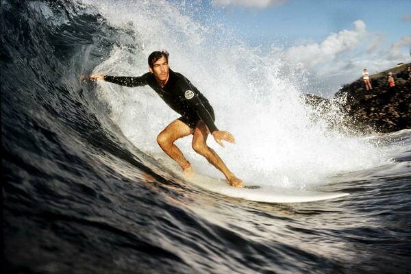 Tributes flow for surfer Michael Peterson