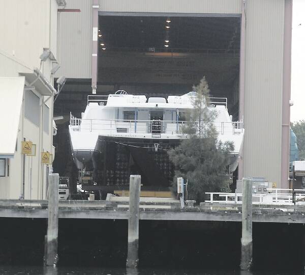 ALL STYLE: Sir Richard Branson's yacht Lady Barbaretta is removed from the boat shed yesterday.- Picture by Natalie Grono