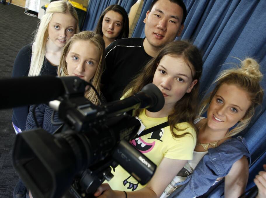 YOUNG FILMMAKERS: Hunter Sports High students Cerissa McCauley, Demmi Gordon, Bianca Evans, documentary maker Tianci Yang, Emily Mors and Ashlee Blackburn. The youngsters have made a film about bullying. Picture: Anita Jones