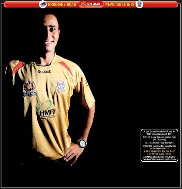 NEW DEAL: Defender Tarek Elrich models the Newcastle Jets' new playing strip yesterday. - Picture by Ryan Osland