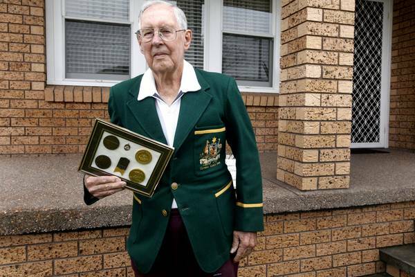 STILL FIT: Kevin  Hallett outside his Singleton home in his Olympic blazer from 1948. Picture: Brock Perks