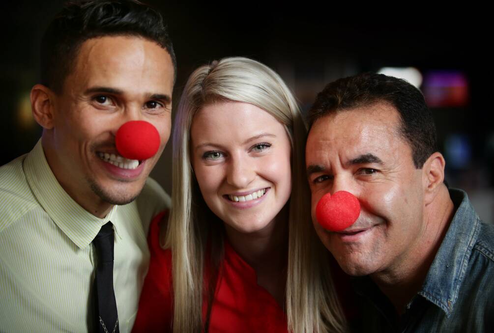 CLOWNING AROUND: Celebrity Apprentice stars John Steffensen, left, and Jeff Fenech get into the spirit of Red Nose Day with SIDS and Kids luncheon organiser Kirily Claut. Picture: Peter Stoop