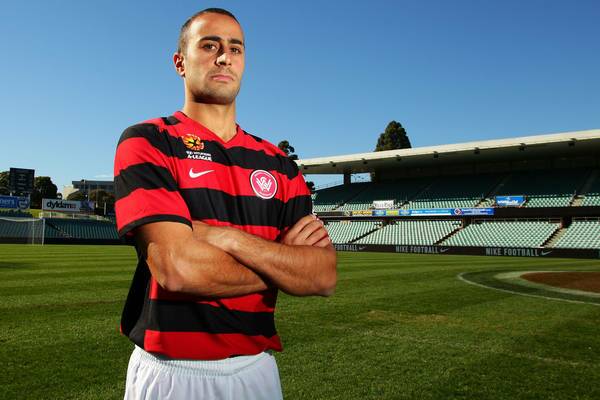 Former Newcastle Jet Tarek Elrich poses in his club's home strip during the launch of the new A-League team, Western Sydney Wanderers FC, at Parramatta Stadium.