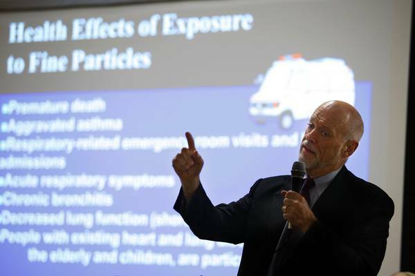 POLLUTION: Professor Peter Orris addresses the meeting  in Mayfield East on air quality.  Pictures: Peter Stoop