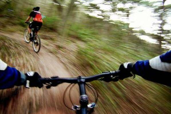 ON THE TRAIL: Mountain bikers at Glenrock State Conservation Area. Conservationists and riders worked to protect sensitive areas.
