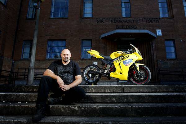 BATTERY TO POWER: Hunter TAFE student Jon Eggenhuizen and his Catavolt, an electric motorbike developed in his Cardiff shed.  Picture: Dean Osland