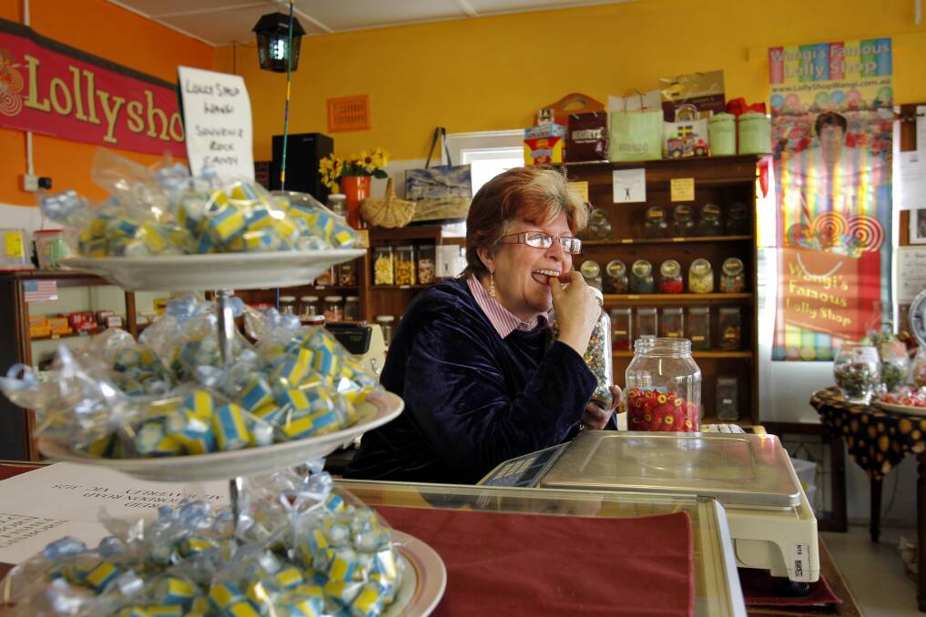 SWEET TOOTH: Lolly Shop Wangi owner Kim Baillie surrounded by her world of colour and sweet scents. Picture: Max Mason-Hubers