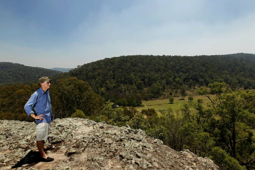 PRISTINE  LANDSCAPE:  Wollombi artist and resident Paul Selwood admires the views of Yengo National Park from his Wollombi property. Picture: JONATHAN CARROLL