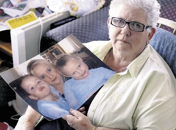 NO HESITATION: Lauri Evans, of Muswellbrook, with a photo of Kelly and her twin daughters Tahlay and Jayde.