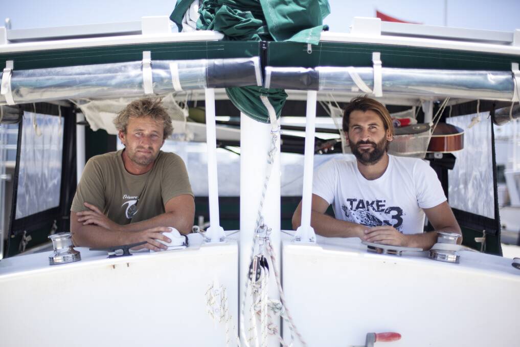 PLASTIC POLICE: Adrian Midwood, left, and Tim Silverwood aboard the sustainable catamaran S.V. Moana.