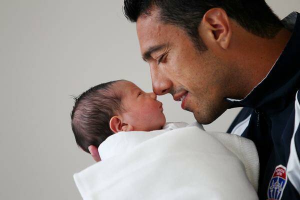 NEW ARRIVAL: Tiago and son Jean Pedro. -- Picture by Ryan Osland