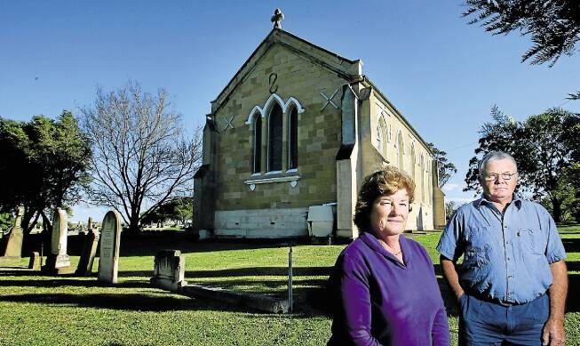 DISGUSTED: Parishioners Wendy Noble and Graham Cheetham at St Clement's church. Picture: Peter Stoop
