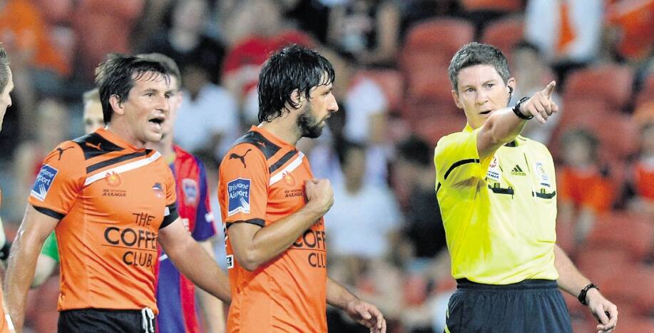 WHO, ME?: Brenton Hayward sends off Thomas Broich. Picture: Getty Images