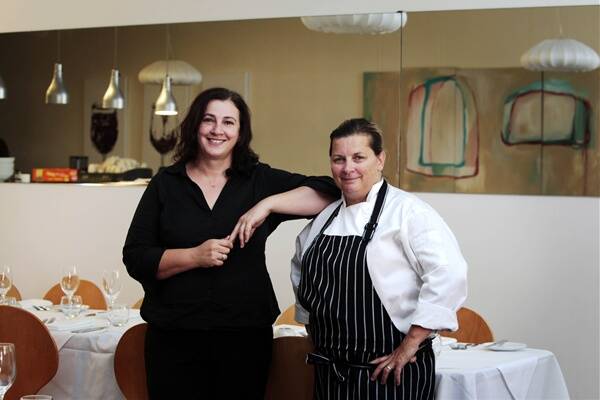 HAT BACK ON: Pauline Sazdanoff, left, and Lesley Taylor in Restaurant Deux. –  Picture by Darren Pateman