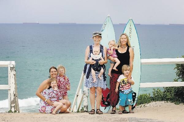 NETWORK OF FRIENDS: Surfing Mums members, from left, Kristen Tola, with her children Luisa and Sophia, Natalie Patterson and her son Timothy, and Lynda Williams and her children Kobi and Eden, at The Cliff at Bar Beach yesterday.- Picture by Dean Osland