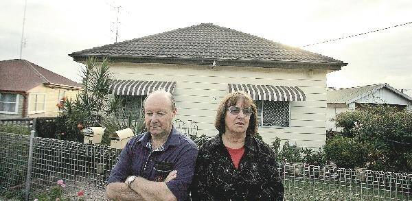 CONCERNED: Tom and Shirley Oaten fear for the value of their property after it was rezoned by Lake Macquarie City Council.- Picture by Natalie Grono