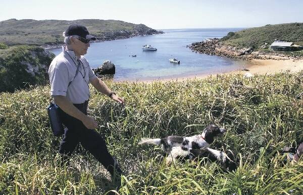 JOB DONE: Katie and Joker with dog trainer Steve Austin on Broughton Island.  - Pictures by Kitty Hill