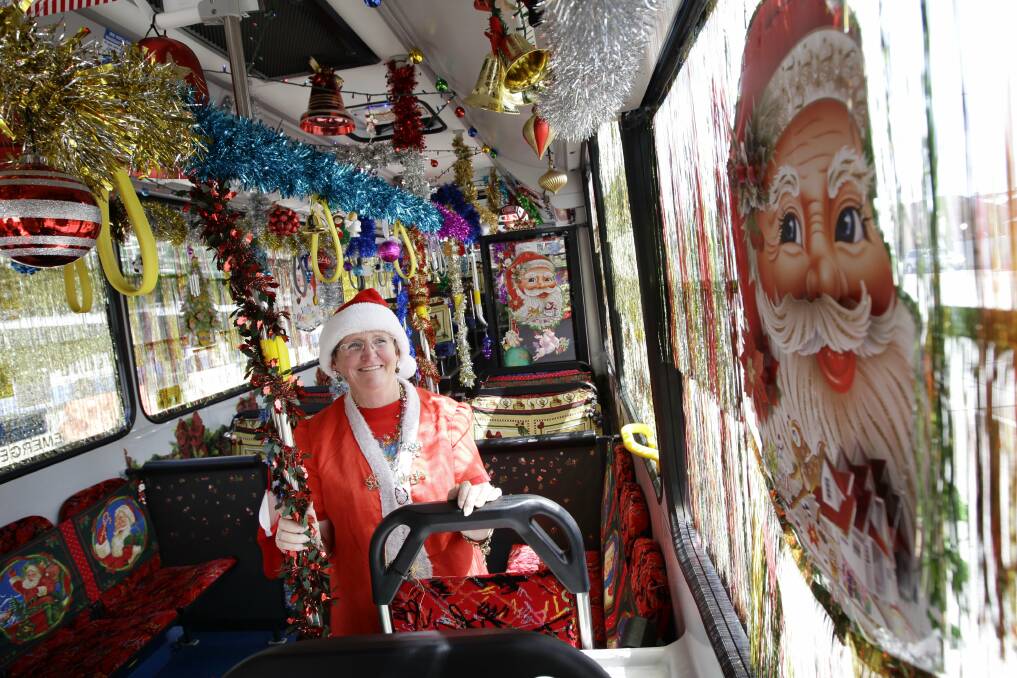 FESTIVE: Bus driver Margaret Pannell started off by trying to cheer up some depressed people over the Christmas period by decorating her bus. Now she is a Newcastle institution.  Picture: Dean Osland