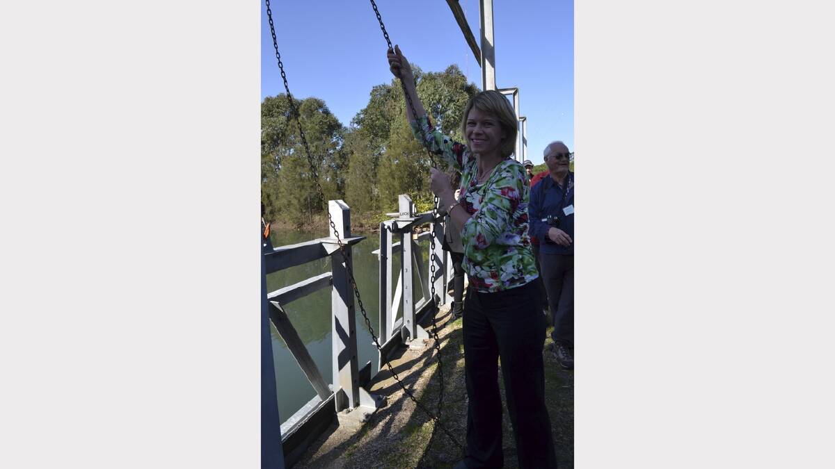 The Hon. Katrina Hodgkinson, NSW Minister for Primary Industries, opens a floodgate at Hexham Swamp on Thursday, July 25,