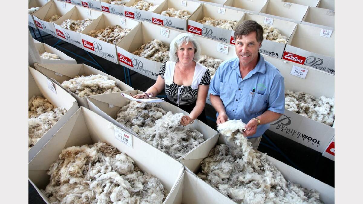 Wool producers Deborah and Morgan Sounness came all the way from Gnowellen Western Australia to Newcastle to sell their wool. Photo shows Deborah and Morgan inside the Elders showroom with their wool. Photo by PHIL HEARNE 